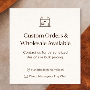 May include: A square card with the text "Custom Orders & Wholesale Available" and "Contact us for personalized designs or bulk pricing." The card also says "Handmade in Marrakech" and "Direct Message or Etsy Chat."