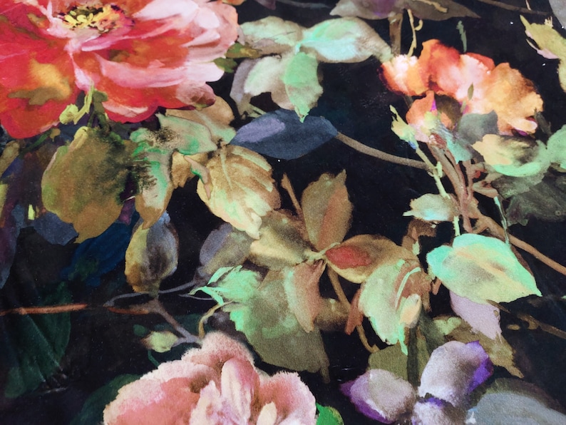 May include: A black background with a watercolor floral pattern. The flowers are pink, red, and orange with green leaves.