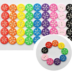 May include: Assortment of colorful wooden buttons with a snowflake design. The buttons are arranged in a rainbow pattern, with red, orange, yellow, green, blue, indigo, and violet buttons.