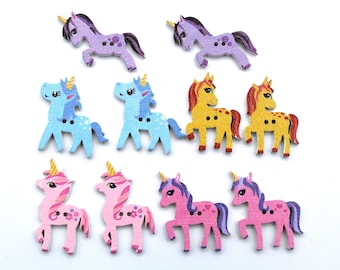 May include: A set of 10 wooden unicorn buttons in various colors, including purple, blue, yellow, and pink. The buttons are painted with details like horns, manes, and hooves.
