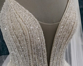 Beaded A-Line Wedding Dress with Spaghetti Straps and Deep Plunging Neckline
