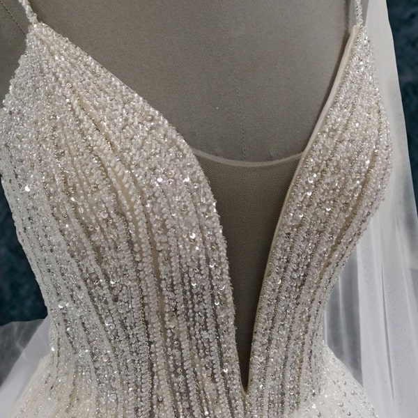 Beaded A-Line Wedding Dress with Spaghetti Straps and Deep Plunging Neckline