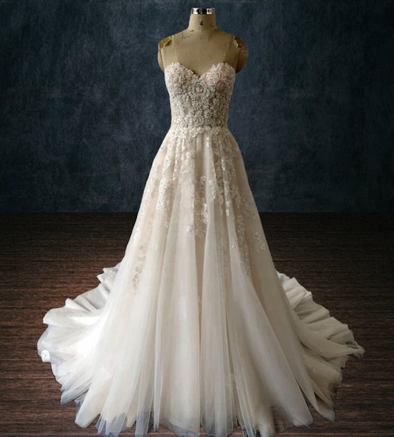 a line lace beaded wedding dress A-Line Wedding Gown A Sheer Corset Bodice With Lace Appliqu And Beaded Spaghetti Straps 18 / Off White
