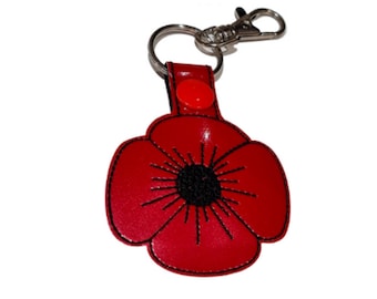 Handgemachter Schlüsselanhänger mit bestickter roter Vinylblume