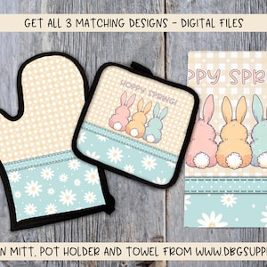 May include: Set of three kitchen items featuring a spring bunny design. The set includes an oven mitt, a pot holder, and a tea towel. Each item has a light blue background with white daisies and a light brown gingham pattern. The oven mitt and pot holder have a black border. The tea towel has the text "Hoppy Spring!" and "Happy Spring!" in a light brown font.