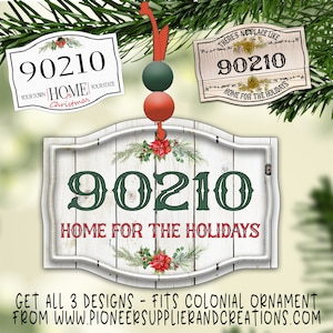 May include: A white wooden sign with a distressed finish and a green and red floral design. The sign has the text "90210 Home for the Holidays" on it. The sign is hanging from a red ribbon and has a green and red bead ornament attached to it.