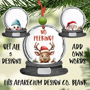May include: Christmas ornament featuring a reindeer wearing a Santa hat, a snowman, and Santa Claus. The ornament has the text "NO PEEKING!" and "GET ALL 3 DESIGNS". The ornament is round and has a black base.