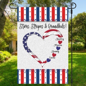 May include: A white garden flag with a red, white, and blue heart design. The heart is made up of an American flag with the words "Stars. Stripes & Grandkids!" above it. The names Bailey, Mason, Benny, and Lucas are written below the heart, each with a small red or blue heart next to it.