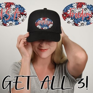 May include: A black baseball cap with three different patches featuring red, white, and blue floral designs. The patches say "U.S.A", "Freedom", and "America".