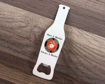 May include: White metal bottle opener shaped like a beer bottle with the text "Once a Marine Always a Marine" and the United States Marine Corps emblem.