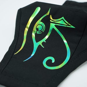 May include: Black face mask with a green, blue, and gold iridescent eye design.