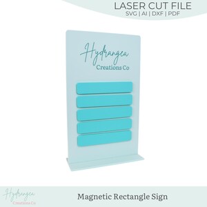 May include: A light blue magnetic rectangle sign with five turquoise rectangle magnets. The sign has the text "Hydrangea Creations Co" and "Magnetic Rectangle Sign". The sign is a laser cut file.
