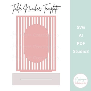 May include: A pink table number template with a vertical striped design and an oval cutout. The text "Table Number Template" is at the top. The image also includes the file types: SVG, AI, PDF, and Studio3.