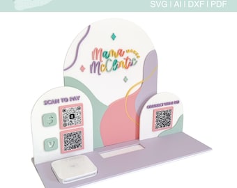 May include: A white square reader holder template with a pink, green, and purple background. The template has two QR codes, one for "Scan to Pay" and one for "Connect with Us". The template also has the text "Mama McClintic" in rainbow colors.