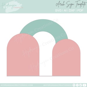 May include: A digital template for an arch sign, featuring two pink half-circle shapes and a green half-circle shape on top. The text "Arch Sign Template" is at the top of the image, and the text "SVG | AI | DXF | PDF" is below it.