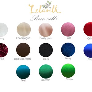May include: A color chart showing 15 different colors of pure silk fabric. The colors are: ivory, champagne, dusty pink, rose, crimson, wine, dark chocolate, black, navy, blue, teal, emerald, and green.