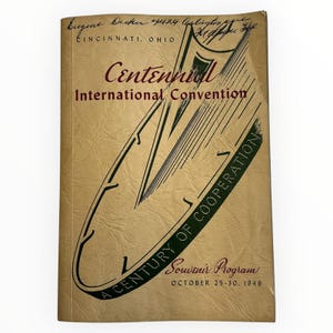 May include: A vintage souvenir program from the Centennial International Convention, October 25-30, 1949. The cover is tan with dark green and maroon text and graphics. The text includes "A Century of Cooperation" and "Cincinnati, Ohio."