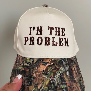 I’m the problem trucker hat, embroidered camo hat, 2 tone camo hat, camo problem hat, cute hat for concert, camo girl hat, trendy camo hat