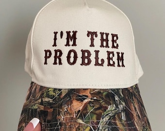 I’m the problem trucker hat, embroidered camo hat, 2 tone camo hat, camo problem hat, cute hat for concert, camo girl hat, trendy camo hat