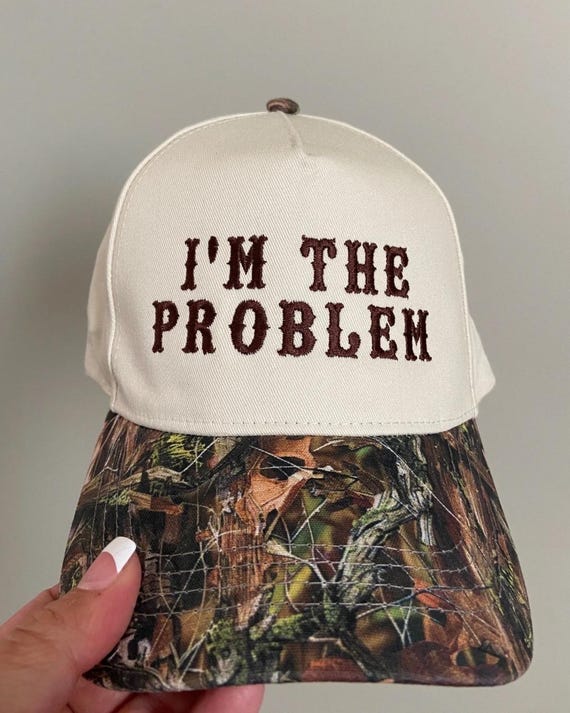 I’m the problem trucker hat, embroidered camo hat, 2 tone camo hat, camo problem hat, cute hat for concert, camo girl hat, trendy camo hat
