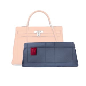 May include: A blue felt bag organiser with multiple compartments and a red felt label with the initials "HW".