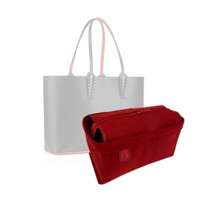 May include: A red felt bag organiser with multiple compartments and a zipper closure. The organiser is designed to fit inside a tote bag.