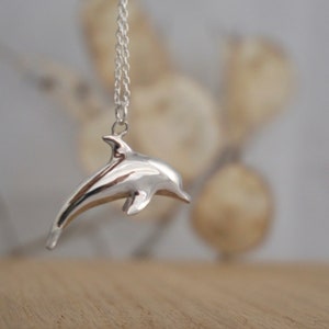 Dolphin necklace ~ playful diving dolphin pendant | Sterling silver jewellery | Gold, rose gold | Hand carved design by Rosalind Elunyd