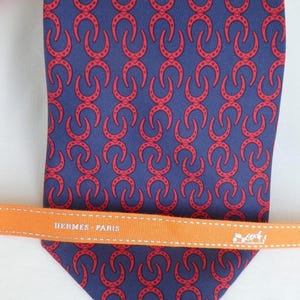 HERMES Men’s Silk Necktie -  Lucky Horshoe Motif, Equestrian - Navy, Red..Made in France. Contemporary French Couture.