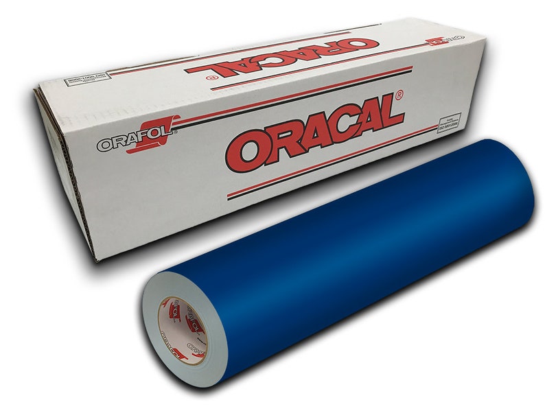 May include: A roll of Oracal 651 vinyl in a deep blue color. The vinyl is wrapped around a cardboard core and is labeled with the Oracal brand name.