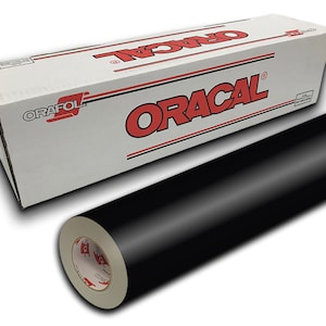 May include: A roll of black Oracal vinyl adhesive film in a white box with red lettering. The box has the brand name "Oracal" printed on it.