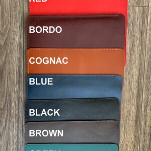 May include: Seven leather swatches in different colors: red, bordo, cognac, blue, black, brown, and green. Each swatch has a white text label with the color name.