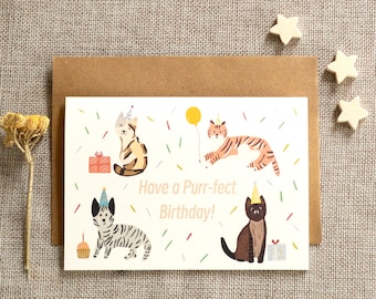 May include: A white card with a birthday greeting that says "Have a Purr-fect Birthday!"  The card features four cats wearing party hats and surrounded by confetti.  One cat is holding a yellow balloon.