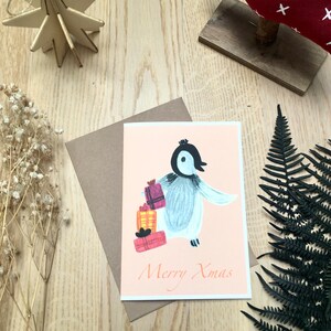 Cartolina di Natale pinguino, cartolina di buon Natale, simpatico pinguino illustrazione