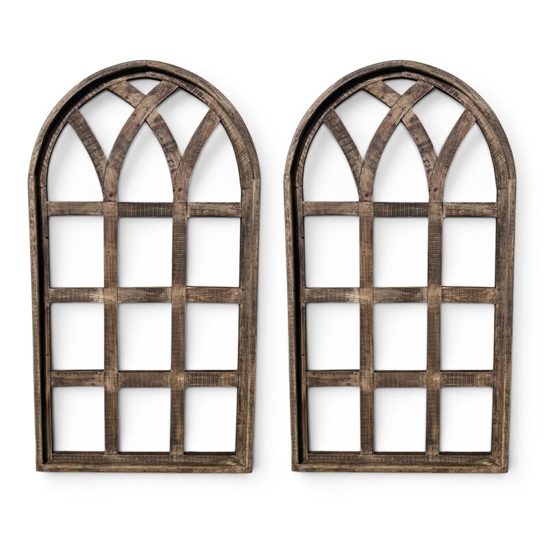 May include: Two decorative wooden window frames with arched tops and a grid pattern. The frames are made of weathered brown wood, creating a rustic aesthetic. The windows are empty, with a white background visible through the grid.