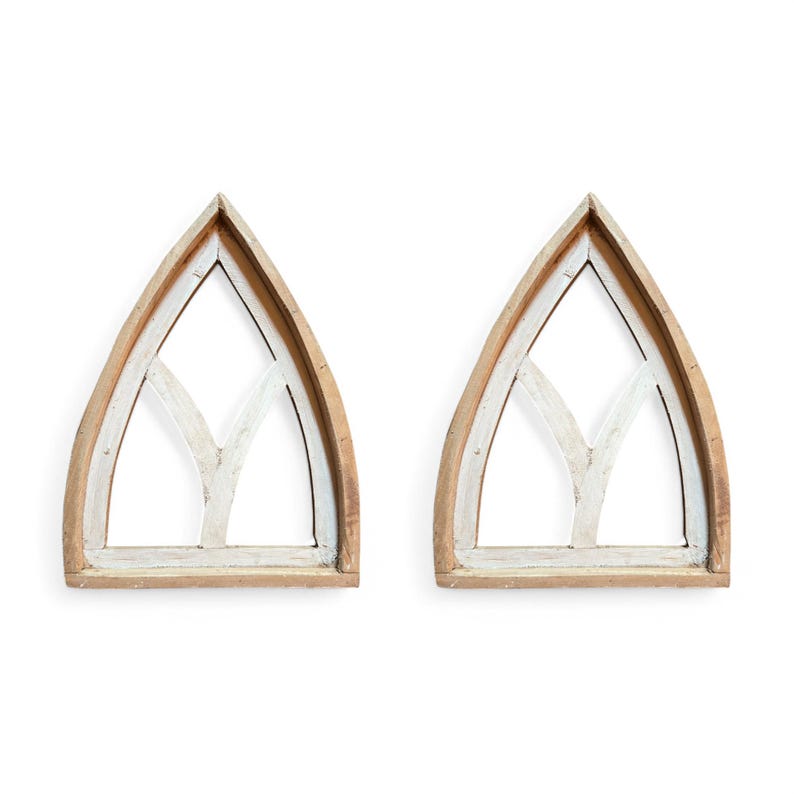 May include: Two wooden arched window frames with a white painted design. The frames are unfinished and have a rustic look.