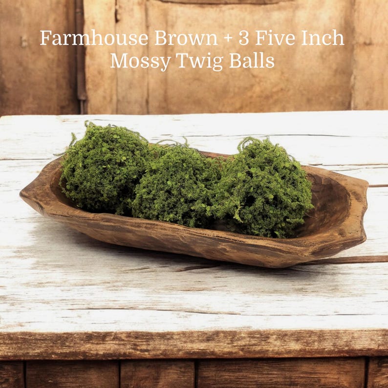 May include: Three green mossy twig balls in a brown farmhouse style wooden bowl. Farmhouse Brown + 3 Five Inch Mossy Twig Balls.
