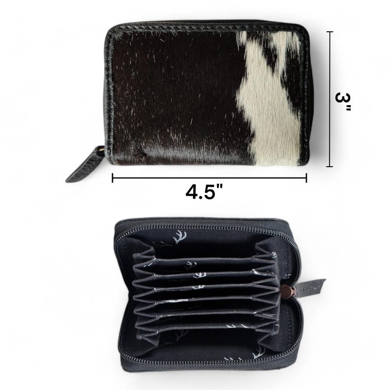 May include: A black and white cowhide leather wallet with a zipper closure. The wallet is 4.5 inches wide and 3 inches tall. The inside of the wallet has multiple card slots.