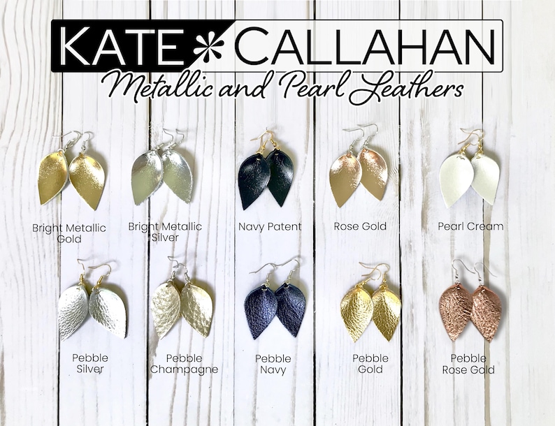 May include: Ten pairs of leather earrings in various colors and finishes, including gold, silver, rose gold, navy, cream, and champagne. The earrings are shaped like teardrops and are arranged in two rows of five. The text "KATE CALLAHAN Metallic and Pearl Leathers" is at the top of the image.