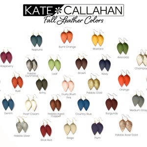 May include: A collection of 24 different colored leather earrings in the shape of a teardrop. The colors include: Burnt Orange, Mustard, Raspberry, Pebble Gunmetal, Leaf, Brown, Navy, Avocado, Champagne, Light Gray, Rust, Army, Pebble Gold, Dusty Blush Pink, Orange, Pearl Beige, Denim, Pearl Cream, Pebble Aged Copper, Country Blue, Burgundy, Pebble Silver, Brick Red, Beige, and Plum.