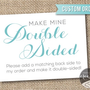 May include: White card with the text "MAKE MINE DOUBLE SIDED" in black and blue lettering. The text "Please add a matching back side to my order and make it double-sided!" is in black lettering. The bottom right corner of the card has the text "GRAPHIC RIVER creative" in black and blue lettering.
