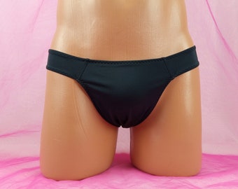 May include: Black underwear with a low rise and a thong back.