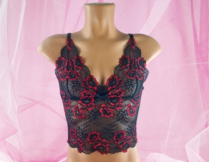 May include: Black lace lingerie top with red floral embroidery.