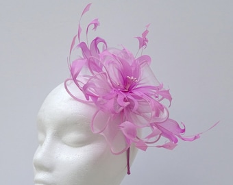 Flower effect candy pink fascinator with feathers for weddings, race days or special occasions.