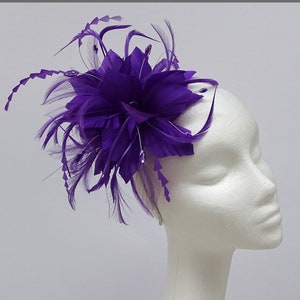 Purple flower fascinator headpiece on a headband for weddings, ladies day, special occasions.