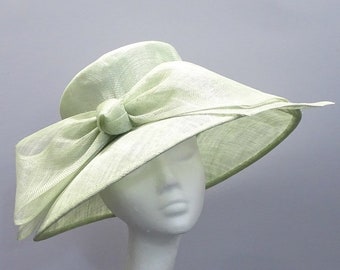 Ladies occasion hat in pale green with bow for weddings, derby day, race days.