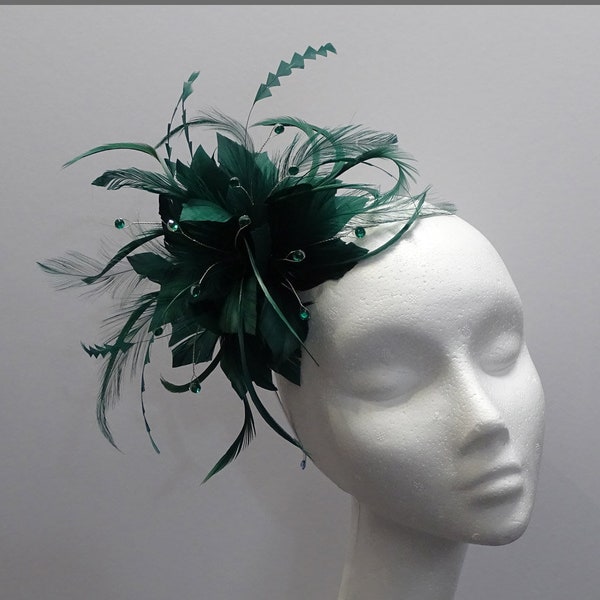 Emerald green flower fascinator headpiece on a headband for weddings, ladies day, special occasions.