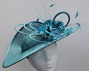 Teal hatinator with faux flower and feathers for weddings, ladies day, derby or race days.