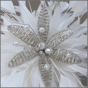 Floral fascinator with large spray of white feathers perfect for weddings, race days or formal occasions. image 2