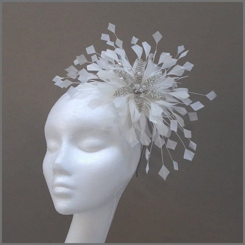 Floral fascinator with large spray of white feathers perfect for weddings, race days or formal occasions. image 1