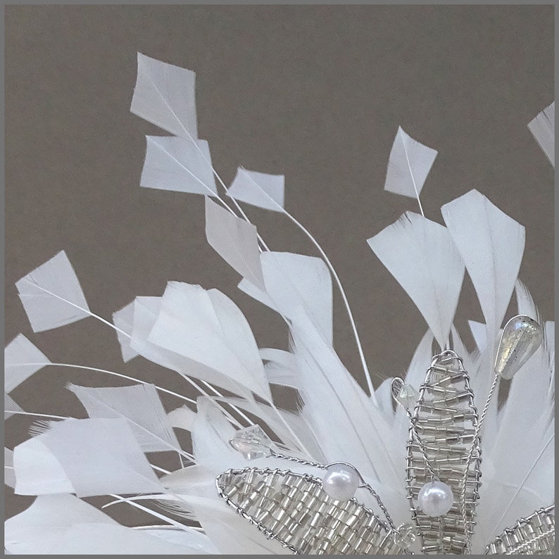 Floral fascinator with large spray of white feathers perfect for weddings, race days or formal occasions. image 3